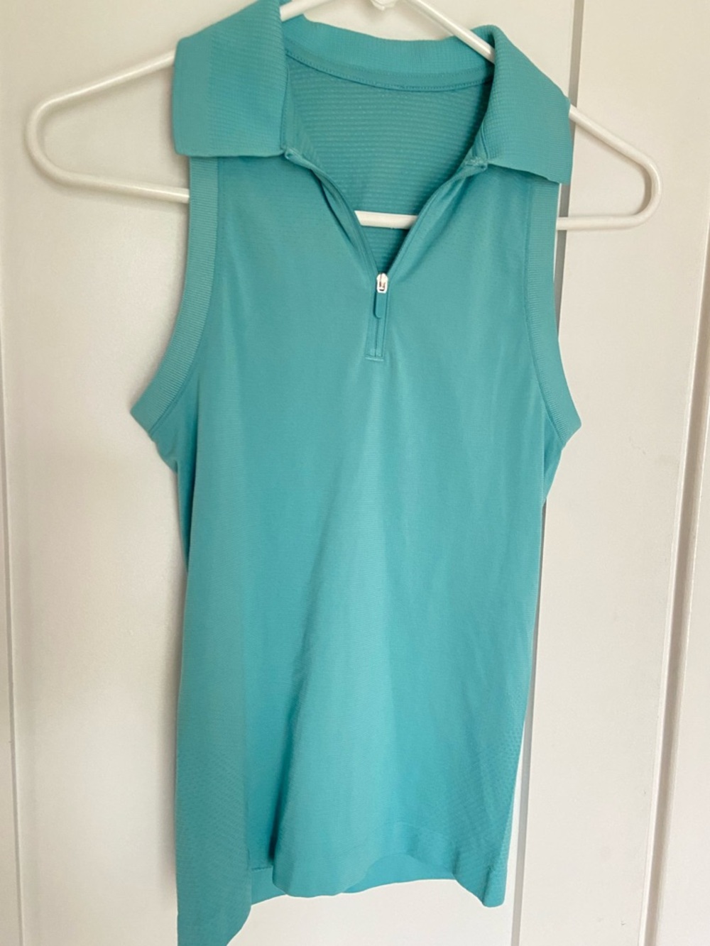 39. Size 2 LULULEMON Teal Sleeveless Polo